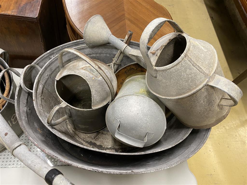 Eight assorted galvanised tubs, feeders and watering cans, largest 80cm, width 56cm